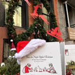 Photos of "Twas The Night Before Christmas" in front of the Chelsea apartment where the author once lived